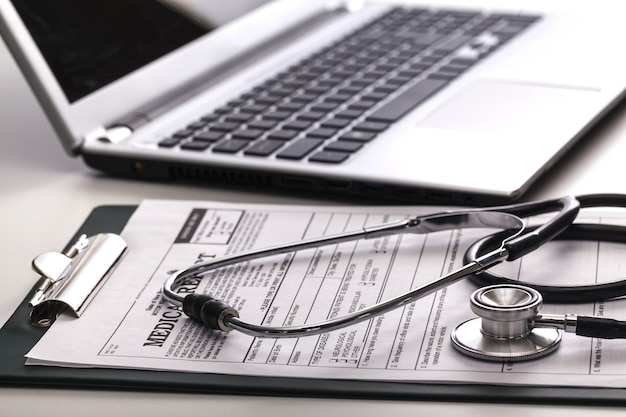 Photo doctor workplace with a stethoscope at table