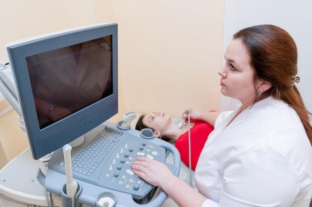 The doctor works in the medical office examining the patientxA