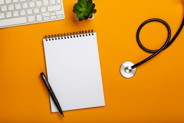 Doctor workspace with medical equipment on yellow table