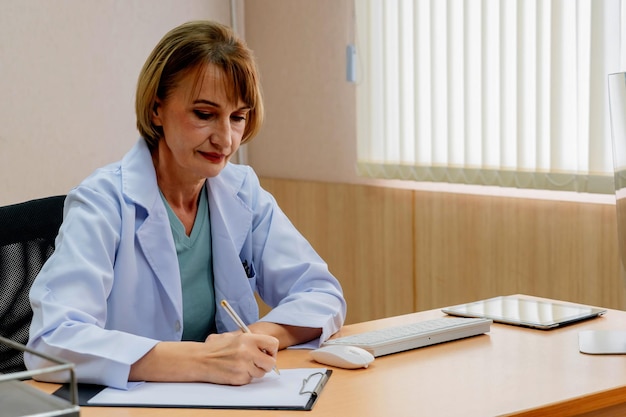 Doctor writing a medical recipe in hospital.