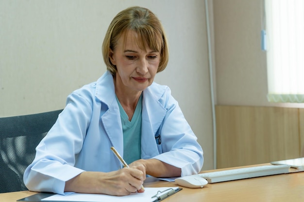 Doctor writing a medical recipe in hospital