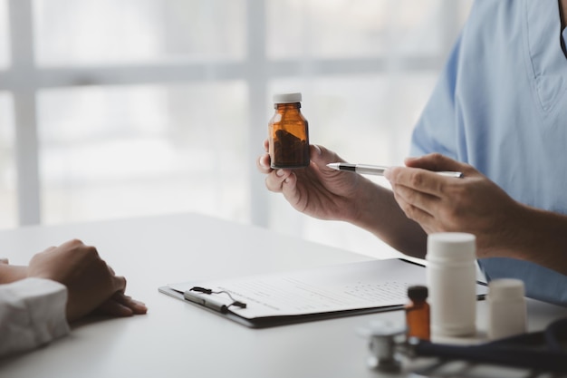 Photo doctors are giving advice on treatment to patients in hospital examination rooms treating diseases from specialists and providing targeted treatment concepts of medical treatment and specialists