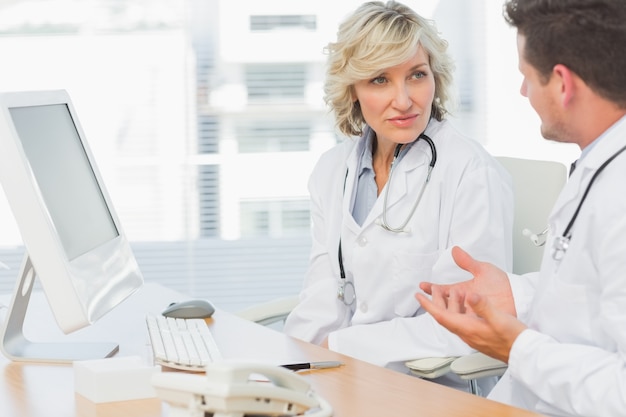 Doctors in discussion at medical office