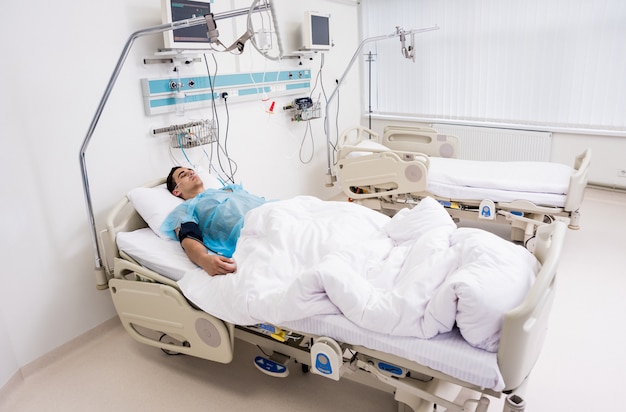 Doctors give resuscitation to a male patient in the emergency room.