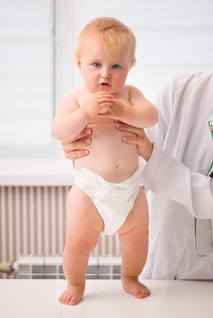 doctors hands holdin a baby