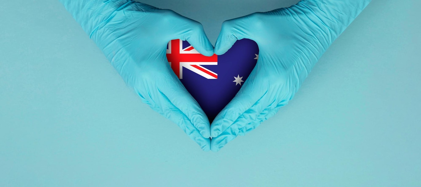 doctors hands wearing blue surgical gloves making hear shape symbol with australia flag 601748 41587 | Stay at Home Mum.com.au