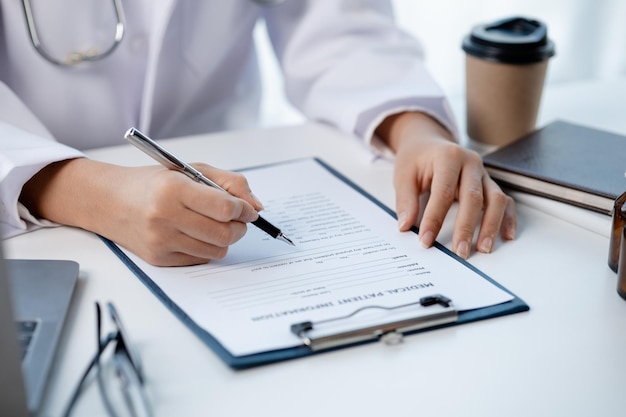 Doctors looking at patient's diagnostic documentation in the hospital's medical room treating diseases from specialists and providing targeted treatment Concepts of medical treatment and specialists