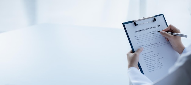 Doctors looking at patient's diagnostic documentation in the hospital's medical room treating diseases from specialists and providing targeted treatment Concepts of medical treatment and specialists