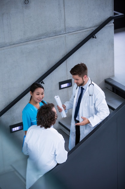 Doctors and nurse having a discussion on stairs