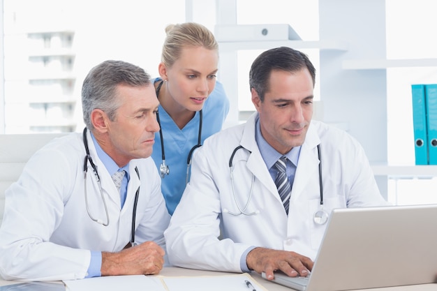 Doctors and nurse working with computer 