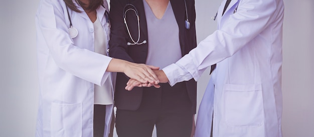 Doctors and Nurses coordinate hands. Concept Teamwork