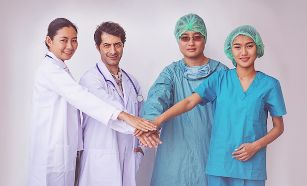 Doctors and Nurses coordinate hands. Concept Teamwork