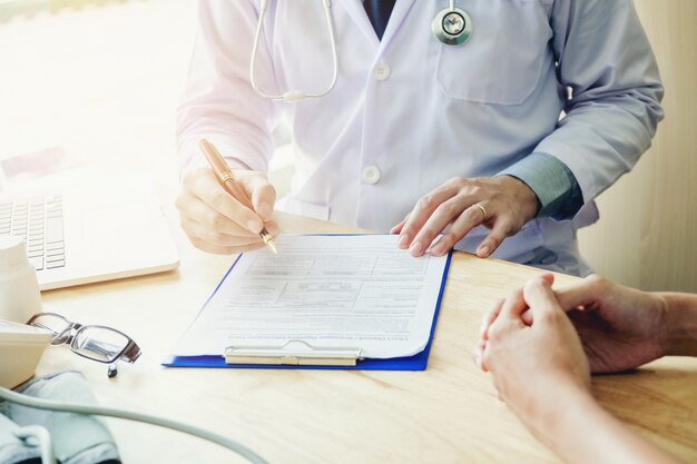 Doctors and patients sit and talk to the patient about medication