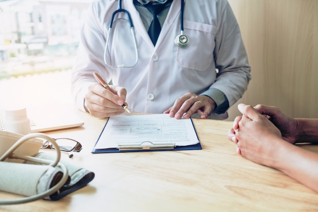 Doctors and patients sit and talk to the patient about medication