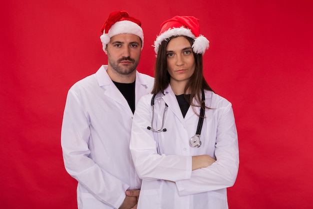 doctors in Santa Claus hats posing