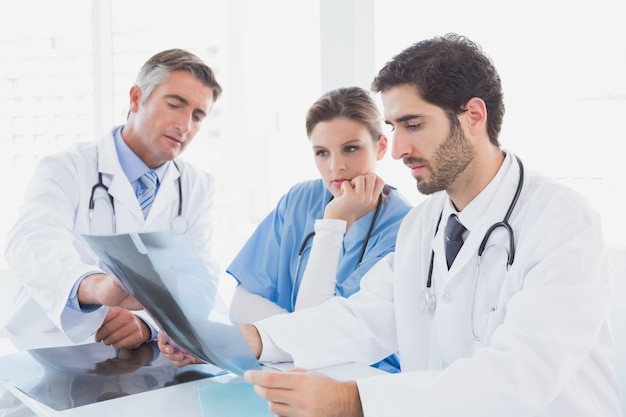 Doctors sitting together with x-rays