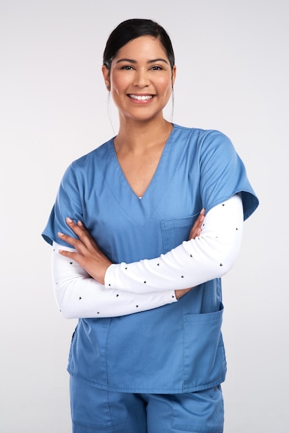 Photo doctors there are roads left in both of our shoes portrait of a beautiful young doctor standing with arms folded against a white background