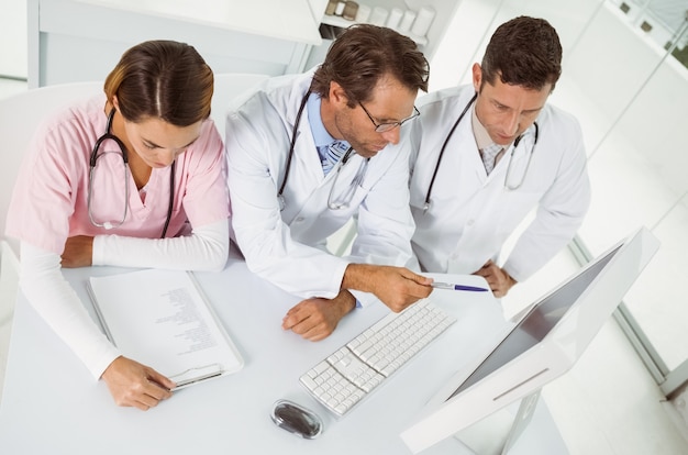 Doctors using computer at medical office