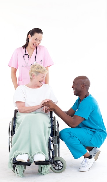 Doctors with a patient in a wheel chair