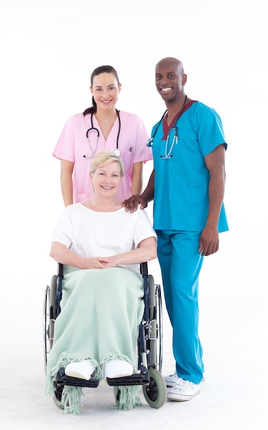 Photo doctors with a patient in a wheel chair