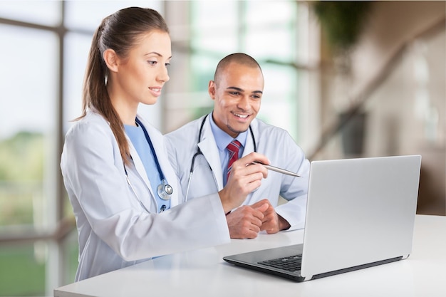 Doctors working on a laptop