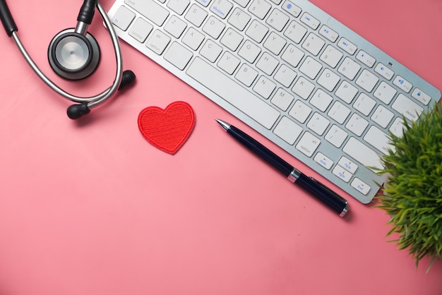 doctors workplace with container keyboard and prescription on desk