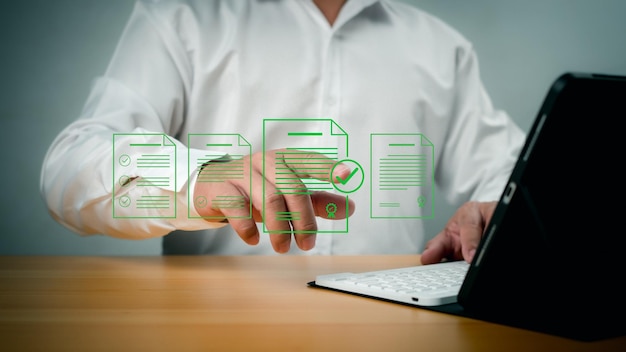document management man signs an electronic document on digital document by virtual notebook screen edocument management paperless workplace esigning electronic signature