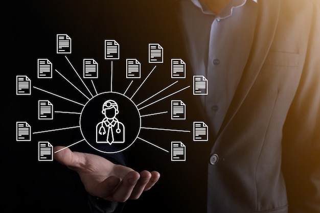 document management system dms .businessman hold doctor and document icon.software for archiving, searching and managing corporate files and information.internet technology concept.digital security.