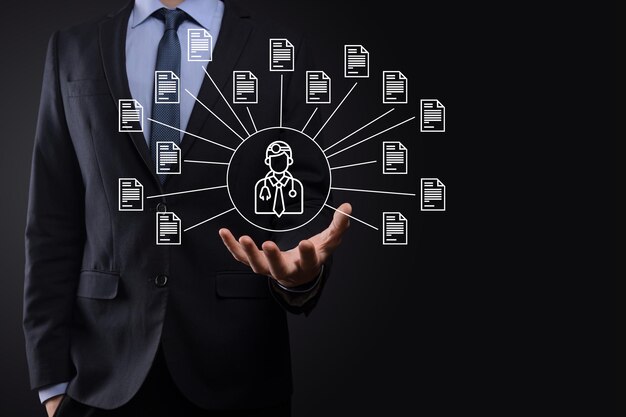 document management system dms .businessman hold doctor and document icon.software for archiving, searching and managing corporate files and information.internet technology concept.digital security.