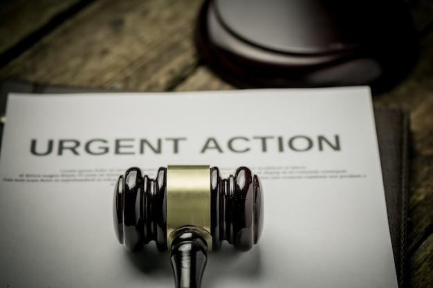 Document Urgent Action with gavel. Class action concept