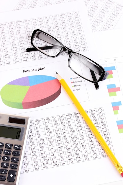 Documents calculator and glasses closeup