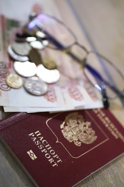 Documents and money on the floor Russian passport and currency