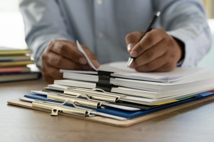 Photo documents  paperwork stack of business paper documents on office on desk accounting paper file