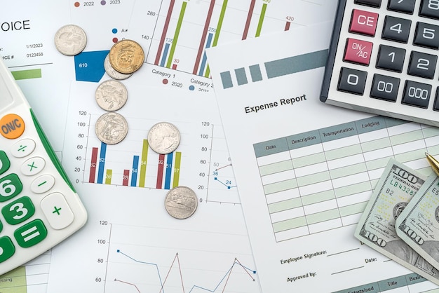 Documents with graphs and diagrams and pen calculator us dollar on deks as financial concept