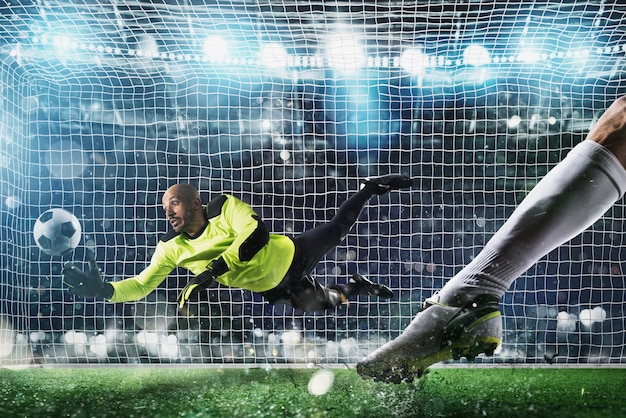 Doelman vangt de bal in het stadion tijdens een voetbalwedstrijd.