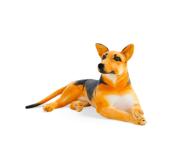 A dog doll that is laying down on a white background