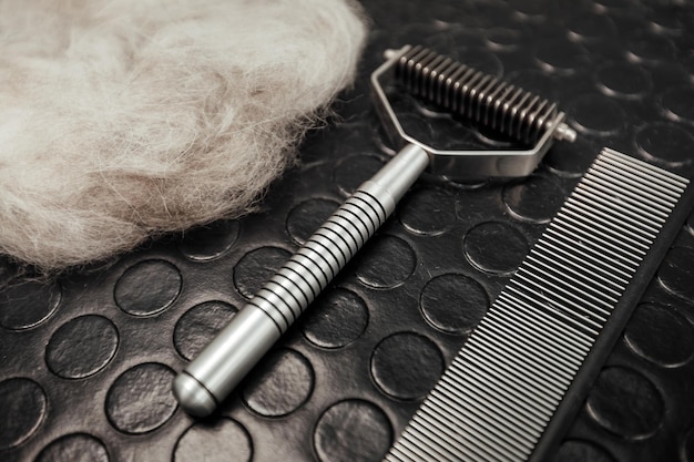 Dog grooming tools and accessories set on black background