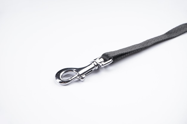 Dog leash with carabiner on a white background. Close-up.