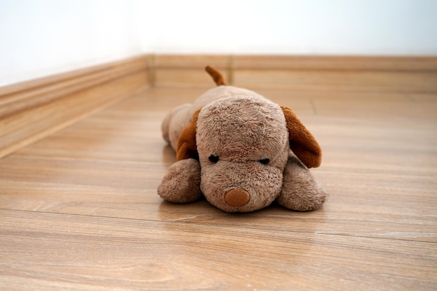 dog stuffed animal on the wooden floor