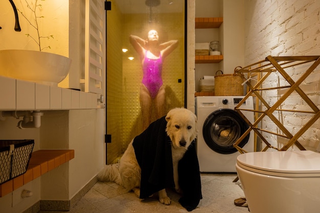 Dog with a woman in bathroom