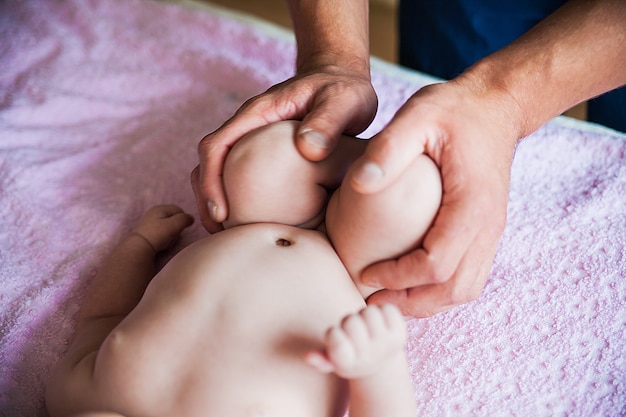 Doing massage for foot little baby