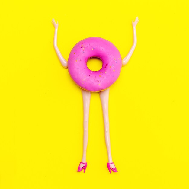 Doll donut. Minimal creative flat lay art