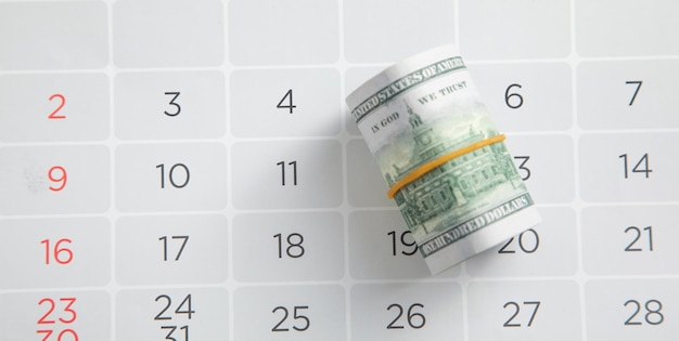 Photo dollar banknote on calendar business