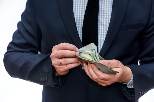 Dollar banknotes in male hands close up