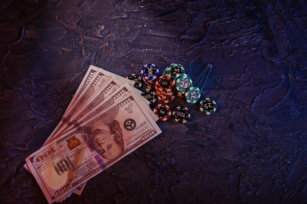 Dollar banknotes and stacks of gambling chips.