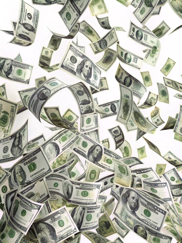 Photo dollar bills flying on a clean white background