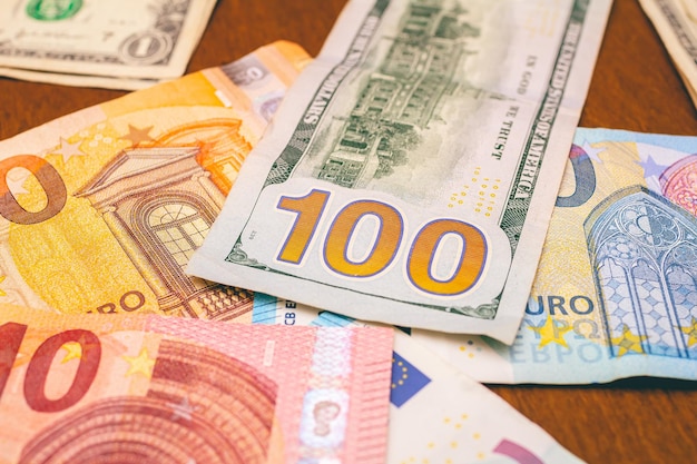 Dollar and euro banknotes on a table for exchange money concept