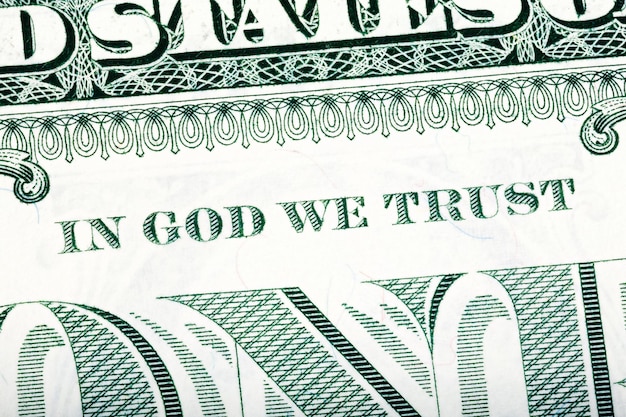 Dollar macro stacked closeup detail photo In God we trust sentence visible Onedollar fragment