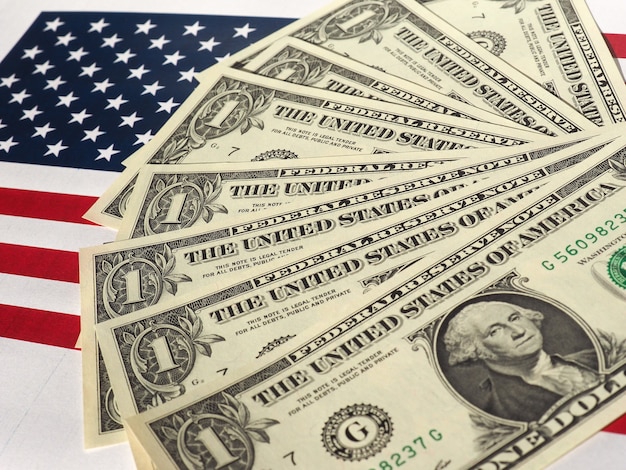 Dollar notes and flag of the United States