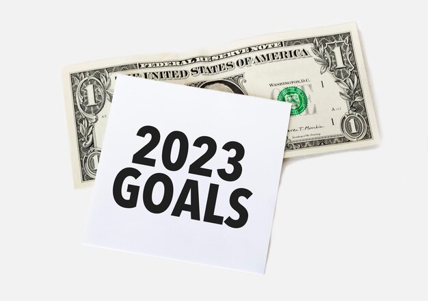 Dollar with white card and text goals 2023